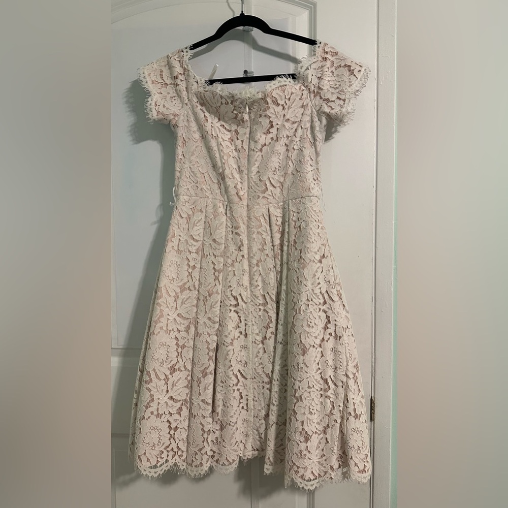 White floral lazed off shoulder dress with pockets. New. Only worn once.